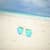 Macro of sunglasses on the beach sands Wallpaper
